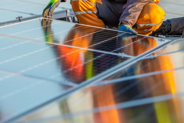 Solar panels installation on rooftop, ideal for any renewable article or wallpaper